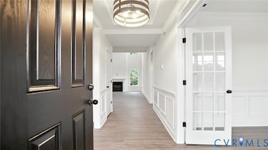 As you enter, you'll be greeted by a formal dining room w/ tray ceiling and a home office with glass French doors located directly off the foyer. 
