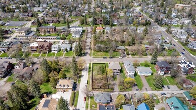 Birds eye view of property with a residential view