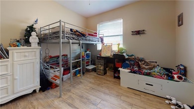 Bedroom featuring wood finished floors
