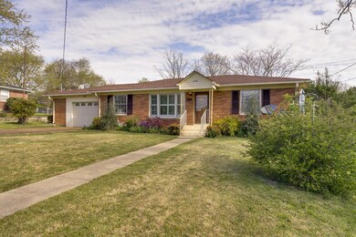FULLY LANDSCAPED YARD WITH SIDEWALK