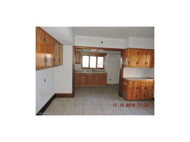 Full sized tiled kitchen dining room