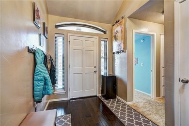 LARGE ENTRY WAY WITH WOOD FLOORS