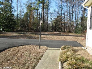 Exterior Front - Sidewalk, paved driveway