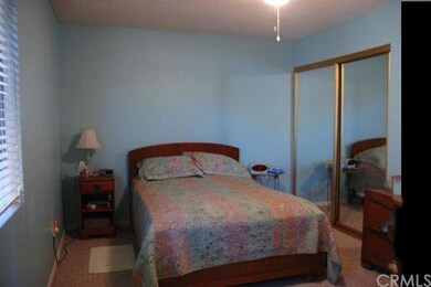 Master bedroom with mirrored walk in closet