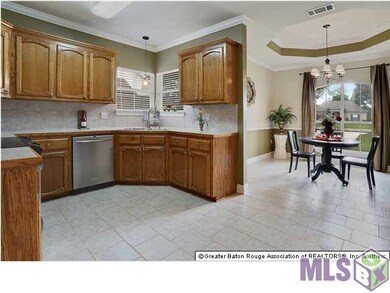 Open Dining with Recessed Ceiling and Bronze Chand