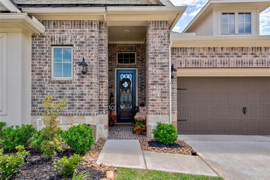 A covered front porch makes it easy to greet neighbors and guests in all kinds of weather.