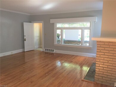 The Front Picture Window is framed on both sides and above in original leaded glass.  the white wood trim on top, provides hidden soft light, that beams up towards the ceiling.