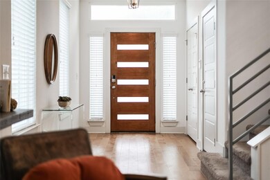 Foyer entrance with stairway and a healthy amount