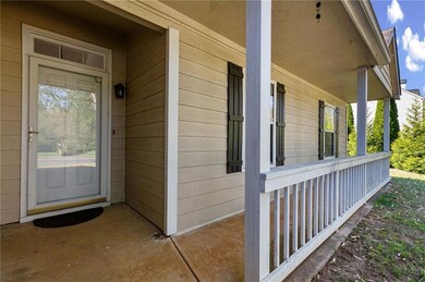 Property entrance with covered porch