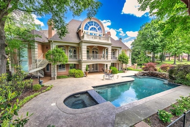 This lap pool includes a jacuzzi on one end of the