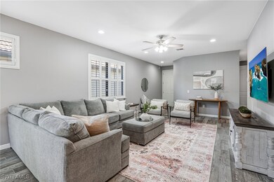 Living area with ceiling fan, wood finished floors