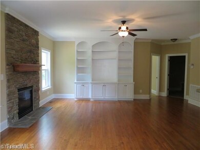 Living Room. Great Room with Stone Fireplace & Built-Ins