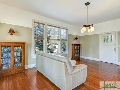 Spacious, bright living room with hardwood floor a
