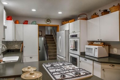 The kitchen has a countertop range and double oven