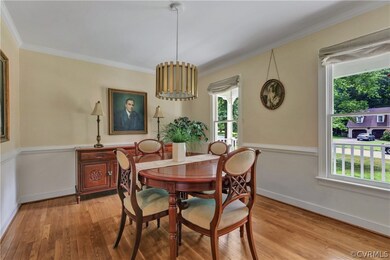 Formal Dining Room with wood floor, crown molding