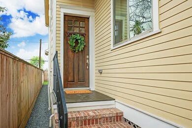 Brick steps lead to a beautiful hardwood craftsman