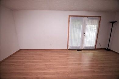 Living Room, French Doors to a concrete rear patio