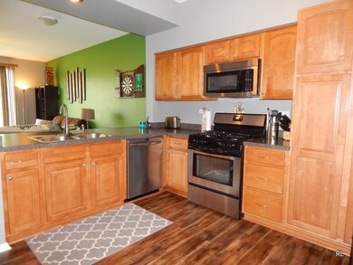 The kitchen was remodeled to open it up (half-wall