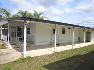 Double carport and covered patio area.