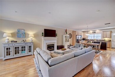 GREAT ROOM INTO DINING AREA AND KITCHEN