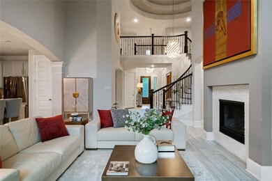 This elegant living room features high ceilings, a