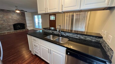 Kitchen with a sink, stainless steel dishwasher, 