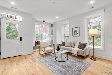 Living room with light wood-type flooring and a we