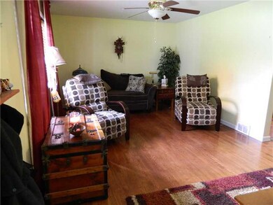 Living Room. Beautiful hardwood floors and large w