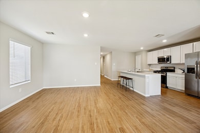 Stainless Appliances adorn the kitchen with Gas cooking and Refrigerator