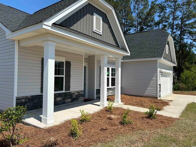 View of front facade with board and batten siding,