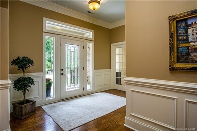 The elegant foyer leads you to exquisite moldings 
