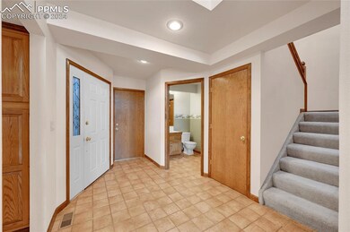 Entryway with light tile floors