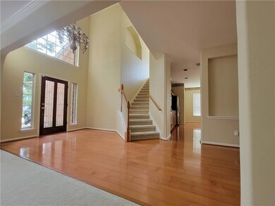 Entrance foyer featuring plenty of natural light,