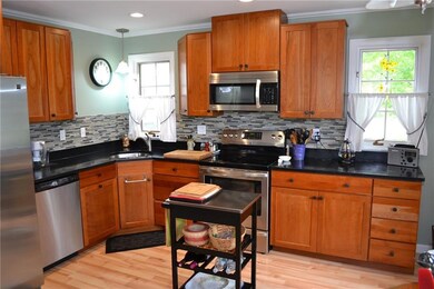 The kitchen has an open design with...