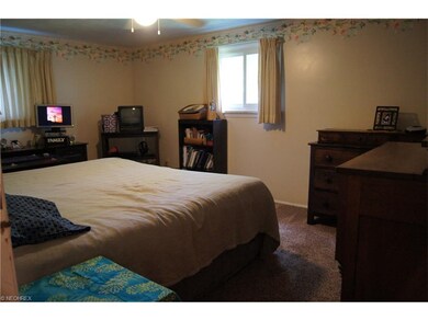 Large master bedroom with his and her closets.