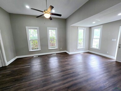 Living/Dining room featuring baseboards, a ceiling