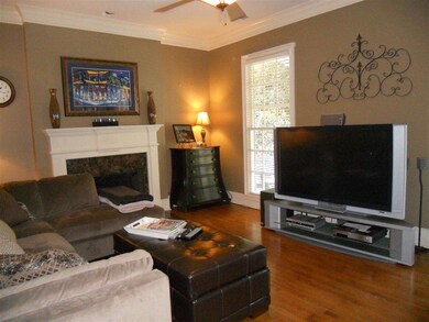 Living room with gas fireplace an hardwood floors