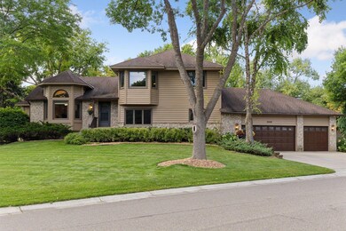 Situated on a sprawling corner lot with mature trees and established landscaping