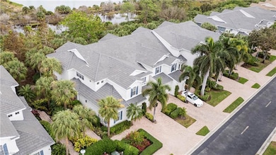Bird's eye view with a water view and a residentia