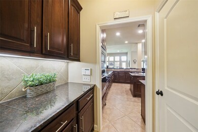 Butler's pantry connects the formal dining room with the kitchen.