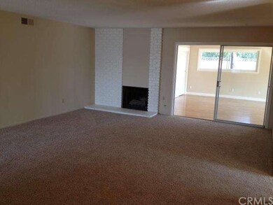 Nice sized living room with fireplace and new carp