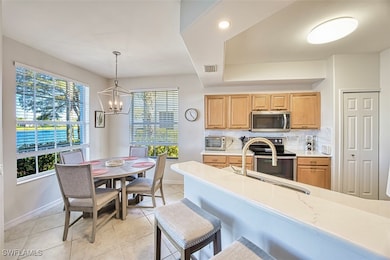 Kitchen with range with electric stovetop, stainle