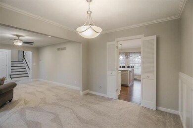 Dining room space connects to living room and to k