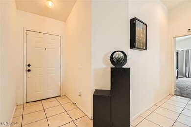 Entrance foyer featuring light tile patterned floo