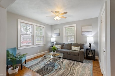 Bright & sunny Living Room w/beautiful hardwood floors.