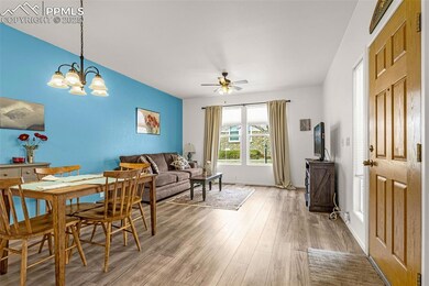 Dining area featuring baseboards, light wood-type 