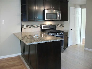 Kitchen. Kitchen eating bar overhang into the Dini