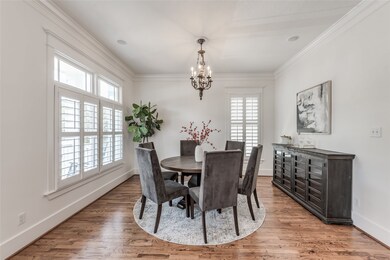 This light-filled room with a period chandelier br