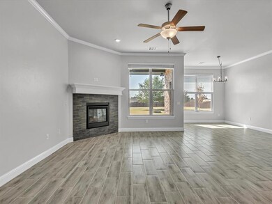 Unfurnished living room with ornamental molding, c