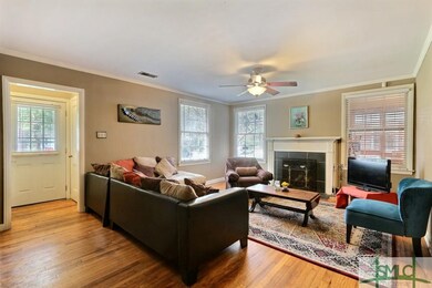 Lovely hardwood floors, living room leads into the